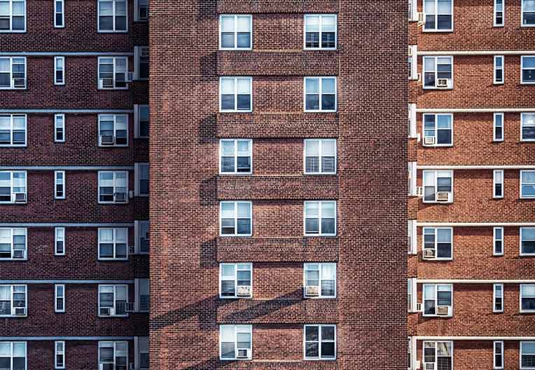 Several blocks of apartment buildings with windows