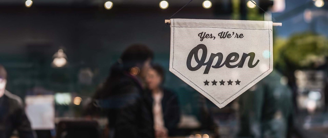 Shallow focus photo of white open signage at a shop