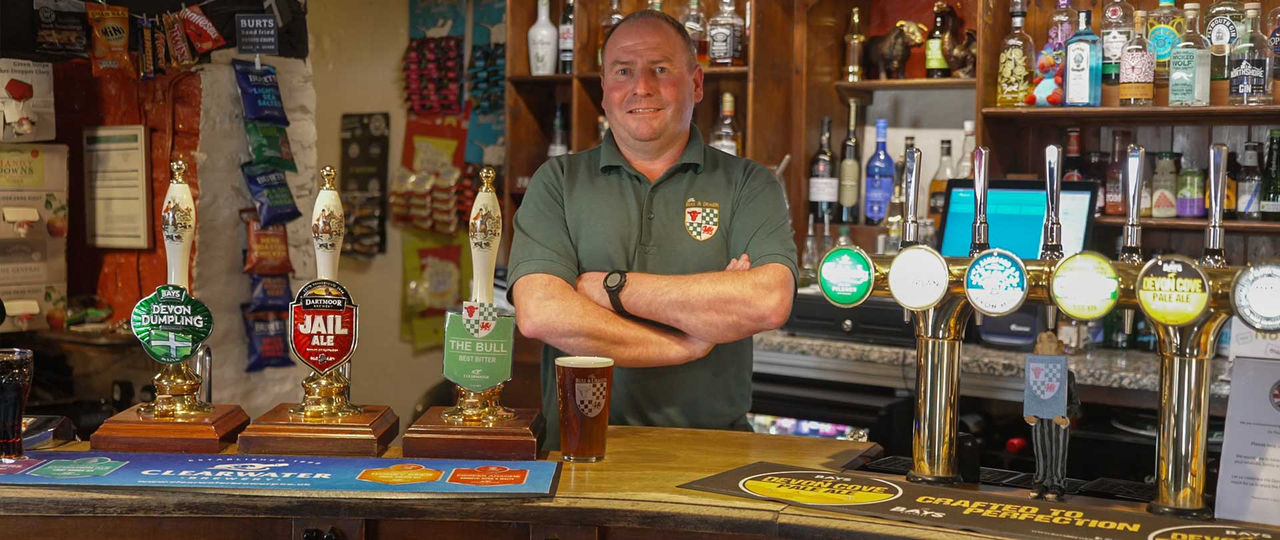 Landlord of The Bull and Dragon pub in Meeth celebrating rural broadband upgrade
