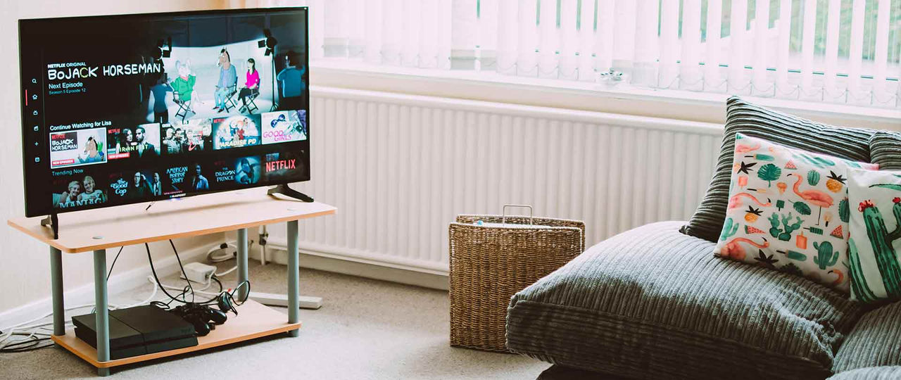 Smart TV in the living room next to a sofa