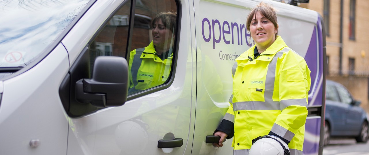 Michelle standing by the van and smiling