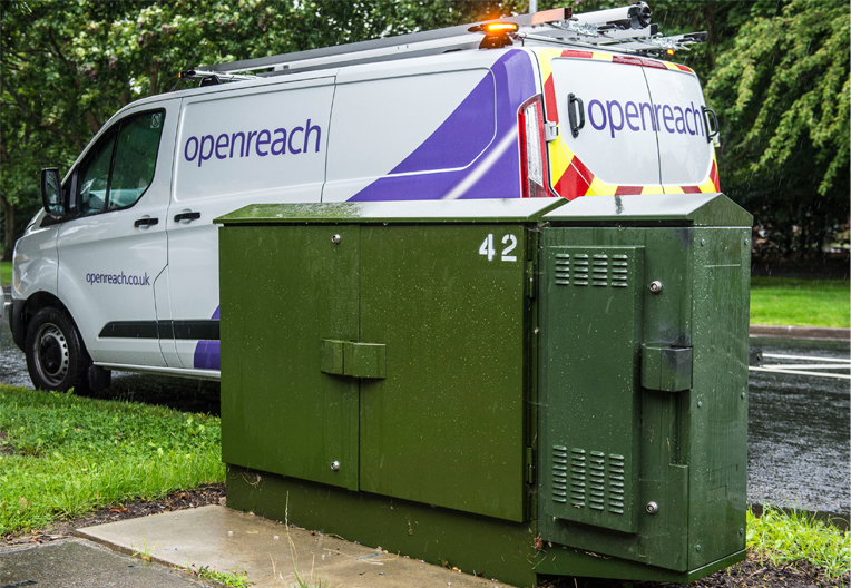 Image of a green street cabinet with an Openreach van behind it