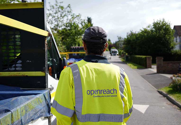 Image of an engineer walking to his van