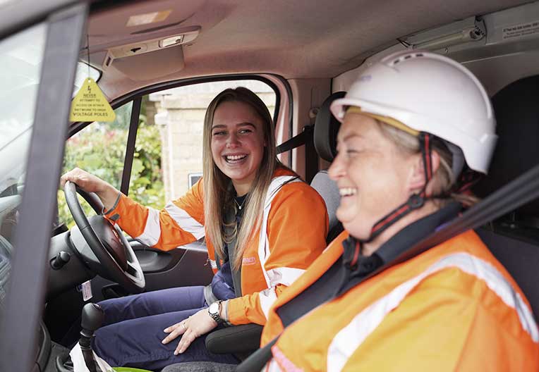 Image of engineers in their van
