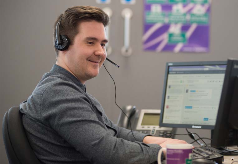 Man wearing a headset Office worker using a headset
