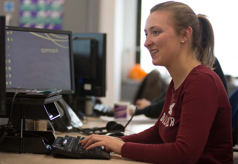 Woman wearing a headset Office worker using a headset