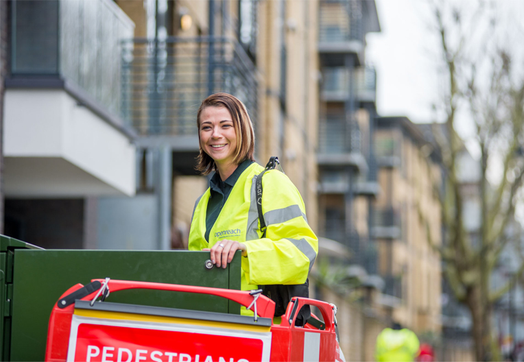 Image of engineer by a street cabinet