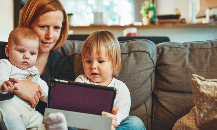 Mum and kids using a tablet