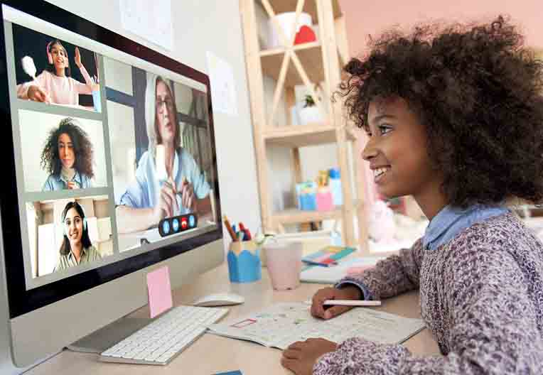 Young girl attending school via a video call
