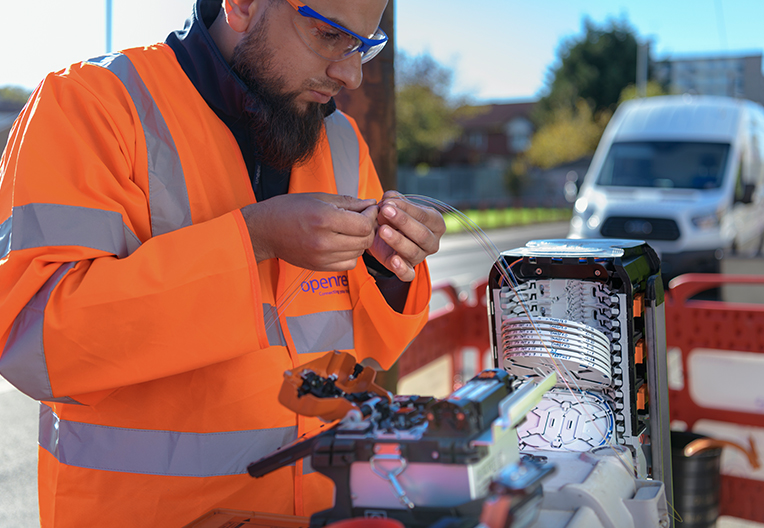 Engineer working on fibre in the street