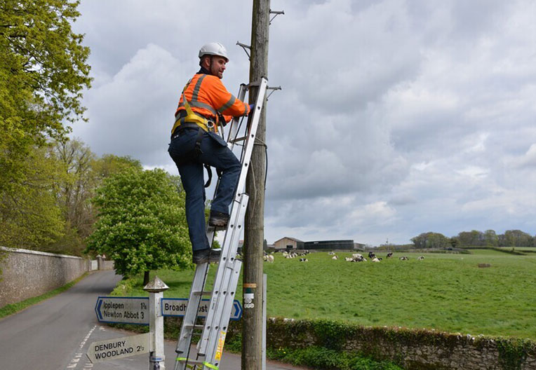 Openreach engineer working on pole