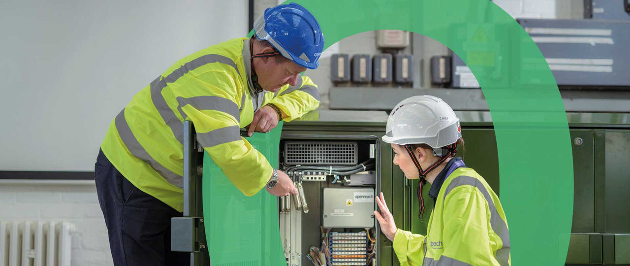 Openreach engineers servicing cabinet