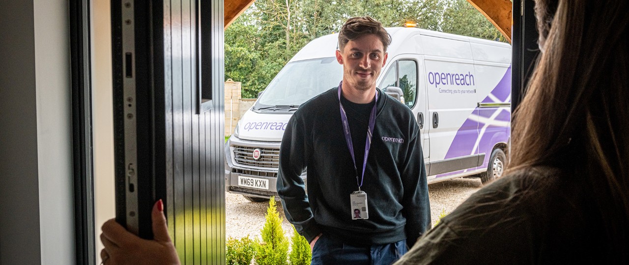 Openreach Engineer at front door helping customers