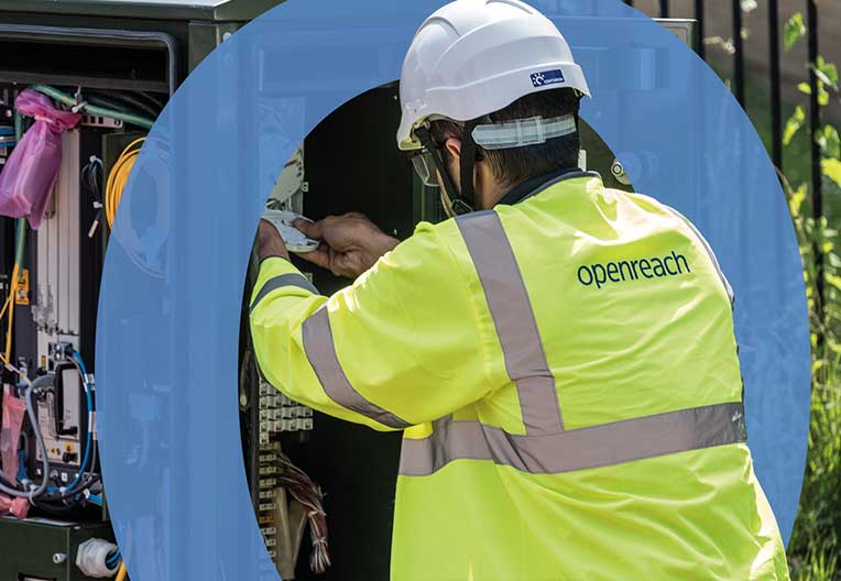 Engineer working inside street cabinet