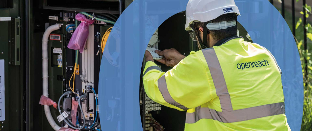 Engineer working inside street cabinet