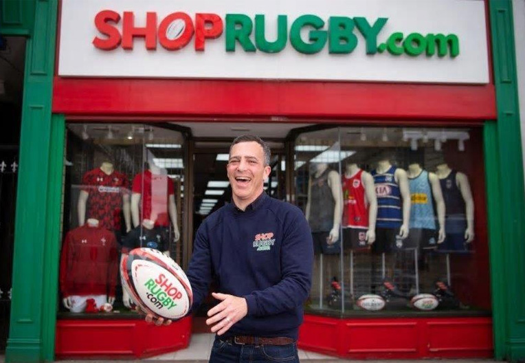 Image of Cardiff shopkeeper outside his shop