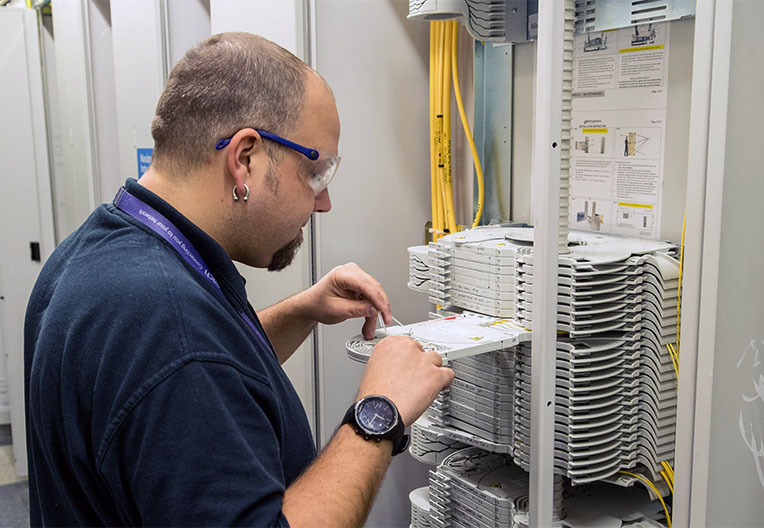 Andrew Goodman working on fibre in an exchange