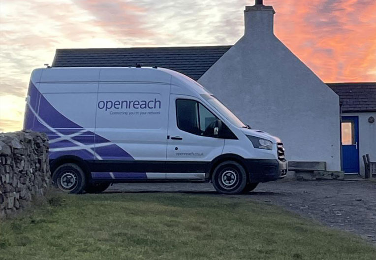 Openreach van parked outside houses in the sunset 
