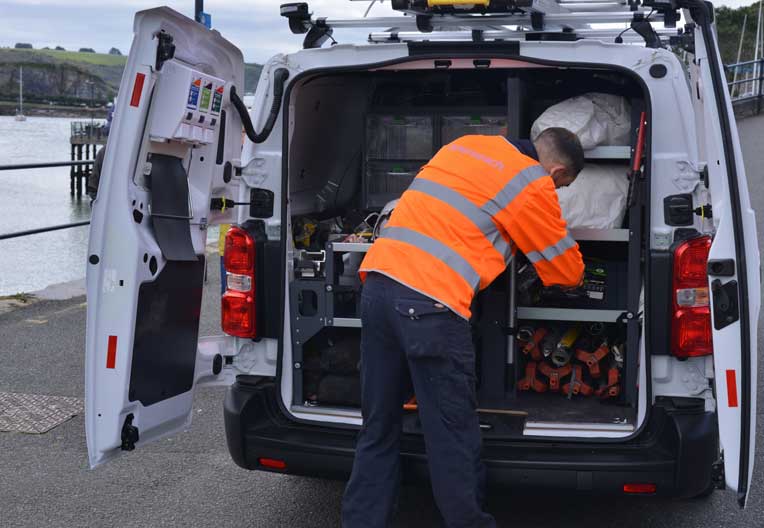 A house in a rural part of Wales with mountains in the horizon